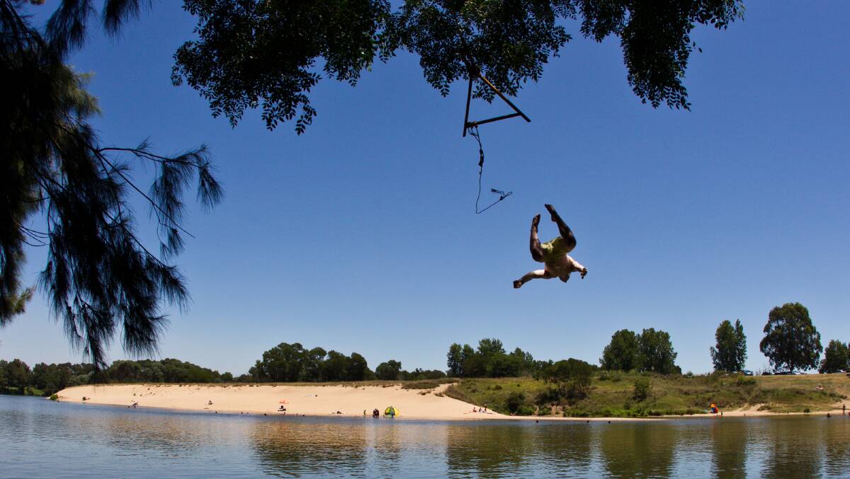 A local dives into the Hawkesbury River at Windsor. Picture: Geoff Jones. A local dives into the Hawkesbury River at Windsor. Picture: Geoff Jones.