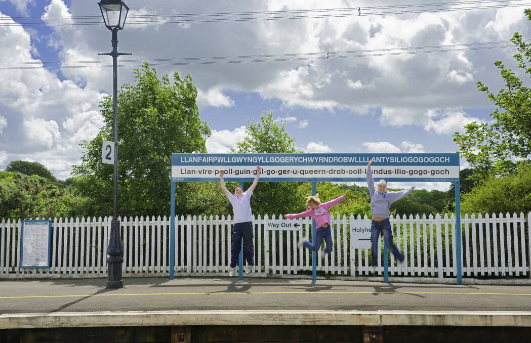 At the train station with the world's longest name. Picture: Visit Wales At the train station with the world's longest name. Picture: Visit Wales