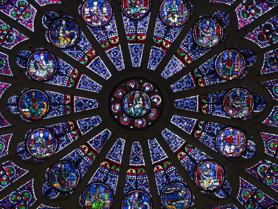 Rose windows shine.
