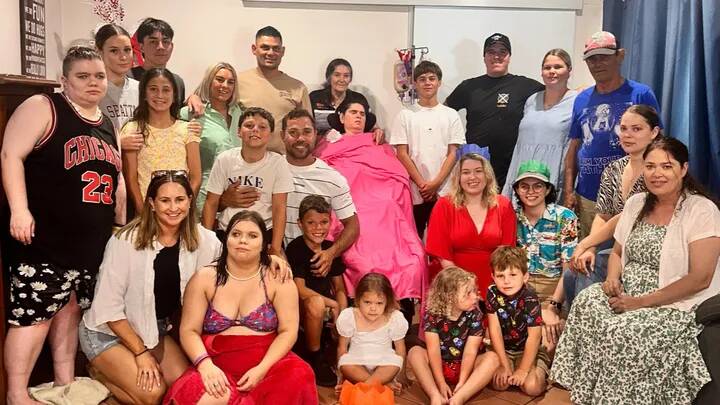 The Little family surrounding Natalie Little during a Christmas celebration in Wagga. Picture supplied The Little family surrounding Natalie Little during a Christmas celebration in Wagga. Picture supplied
