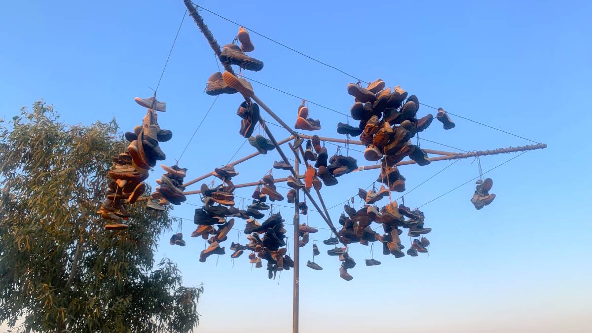 The Kulgera Shoe Tree was replaced with a Hills Hoist when the tree collapsed. Picture by Tim the Yowie Man
