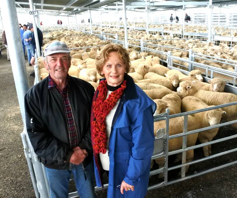 Charity first: Ken and Sue White from Yass donated a sheep that raised $200 for the Yass Hospital Auxiliary and purchased the first pen of the day. Photo: Jessica Cole. 