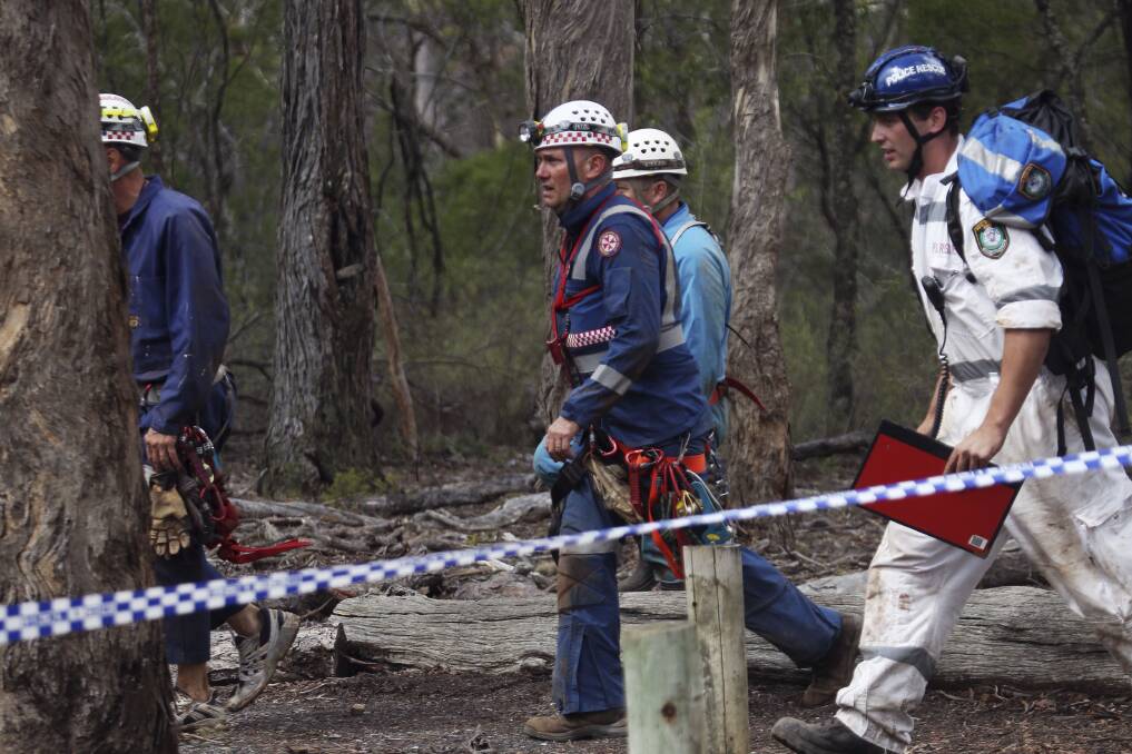 FLASHBACK: NSW Ambulance Specialty Casualty Access Team paramedic Jason Watson (centre) back in fresh air after his 11-hour rescue in the Bungonia cave system in 2014. Photo: Nick Moir