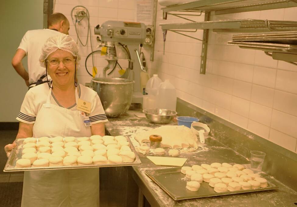 Behind the scenes: Lyn Jacobson rolls out the scones at the Royal Show. Photo: Clare McCabe. 