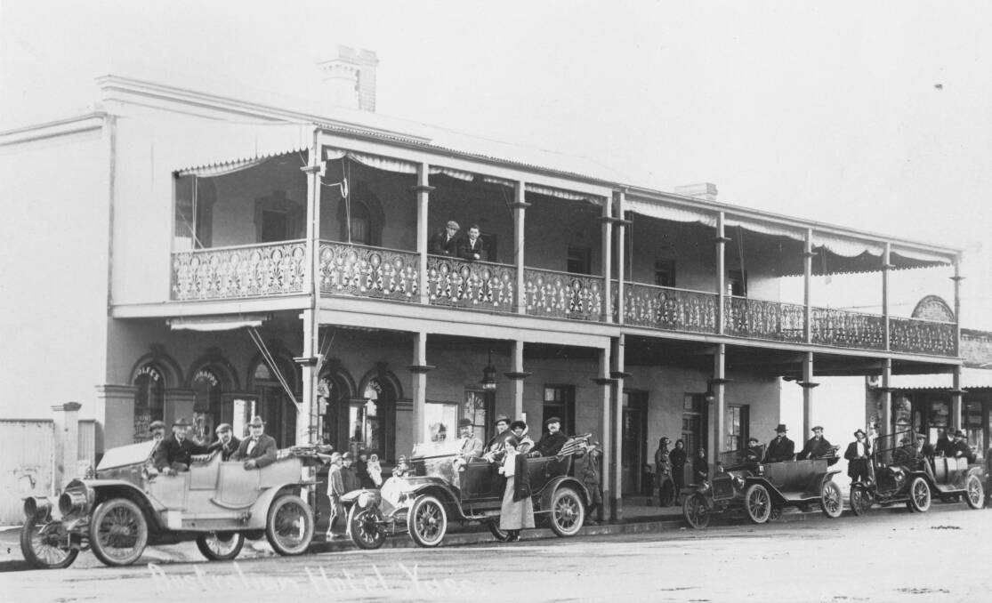 OUT FOR A DRIVE: Vehicles and their smartly outfitted passengers at the Australian Hotel, c1920. Photo: YDHS Archives