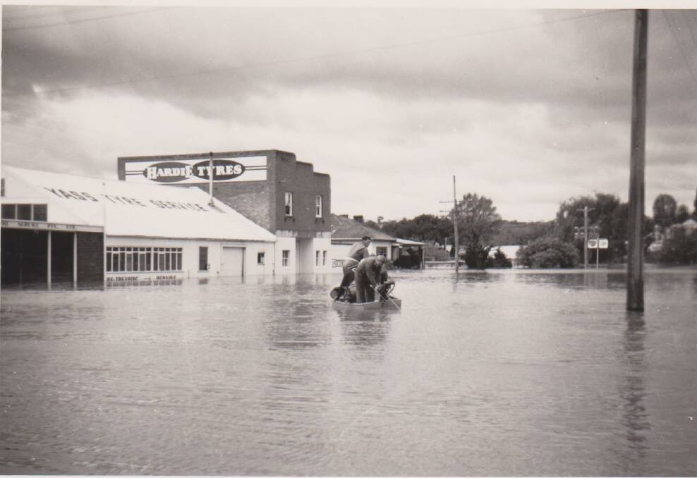 ROW, ROW: Travelling by boat on the corner of Rossi and Comur Street, 1959. Photo: Yass & District Historical Society Collection.