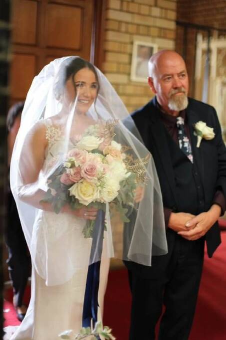 SPECIAL MOMENT: Emma Cocks with her proud dad Stephen, about to walk down the aisle at St Augustine.