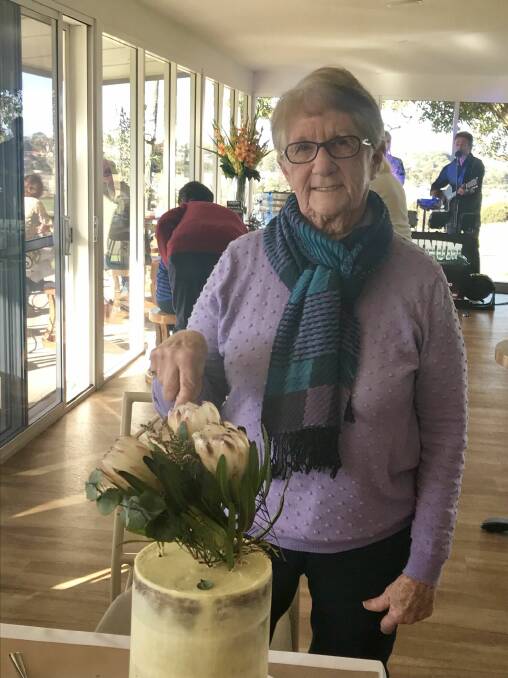 Dorothy Lock cutting her 80th birthday cake on July 1.