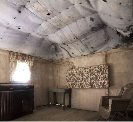 OLD DAYS: The living room of Elsie Offley's house at Wattle Valley is an example of early slab architecture, frozen in time.