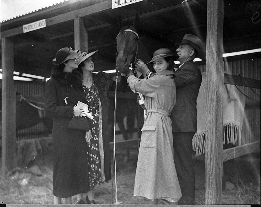 WHO ARE THEY?: Racegoers attending the Yass Picnic Races with Millie Dwyer which ran third in the Gold Cup Race in the 1935. Can you identify these people? Photo: The Collection of the State Library of NSW