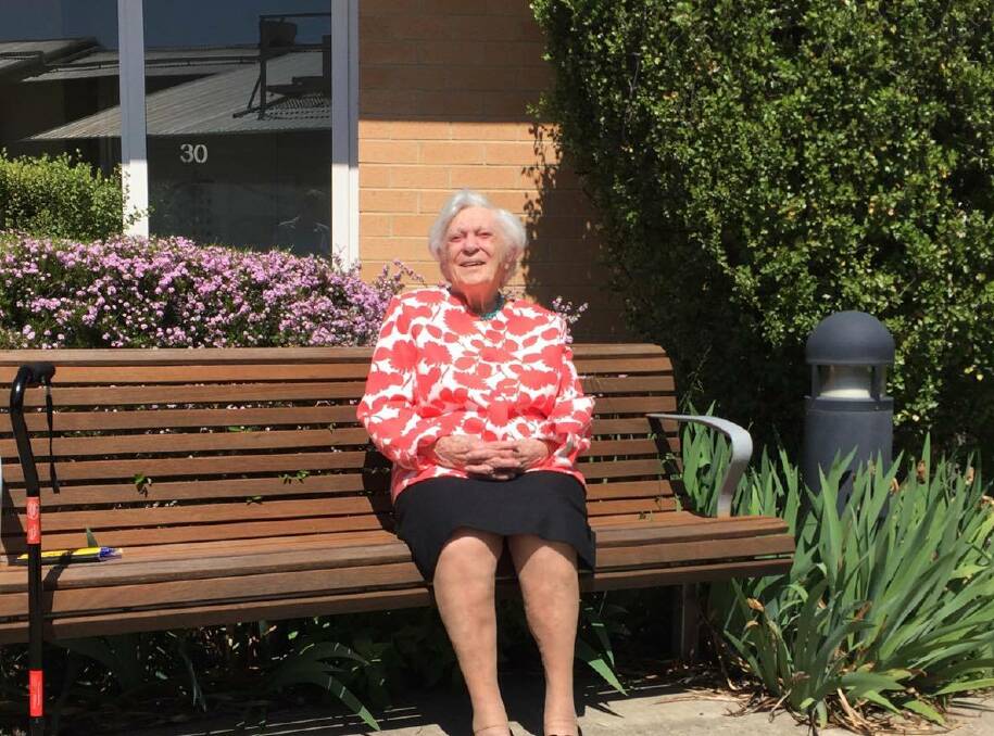 An Even Hundred: Dorothy in the garden of the Gwen Warmington Lodge, which she loves for the support of everyone there. Photo: Zac Lowe. 