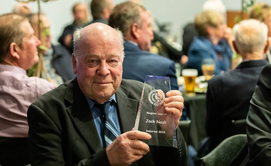 Proud son: Bob Nash holds the trophy which was awarded to his father, Jack, nearly 90 years after the conclusion of his long, storied, and successful playing career for the Magpies. Photo: Cluan Smith.