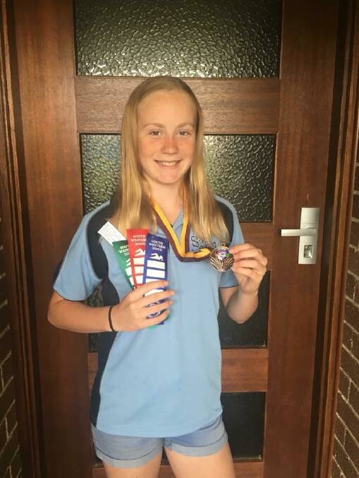 Bronte Anderson shows off some prizes. Photo: Supplied. 