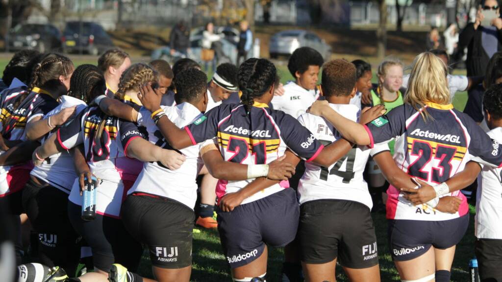 The Brumbies and the Fiji sides interlocked arms after the game and shared a hymn and a prayer. Photo: ACT Brumbies. 