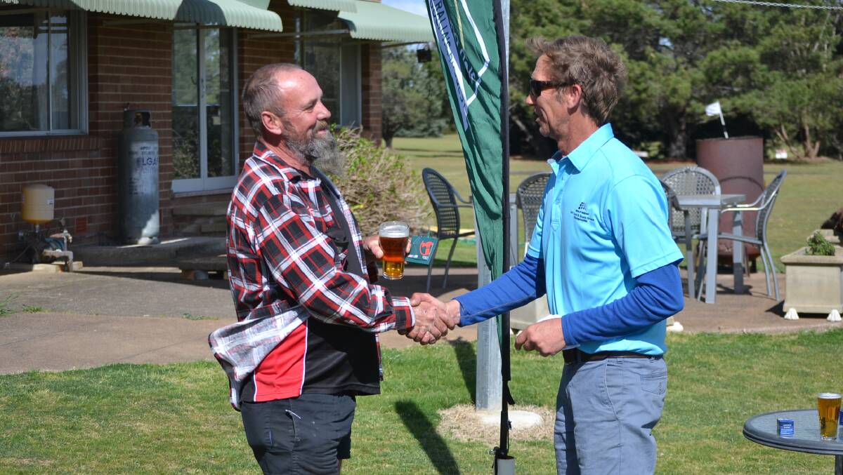 Casual dress: Tony Barton accepting a gift voucher for his success on the weekend. Photo: Zac Lowe. 