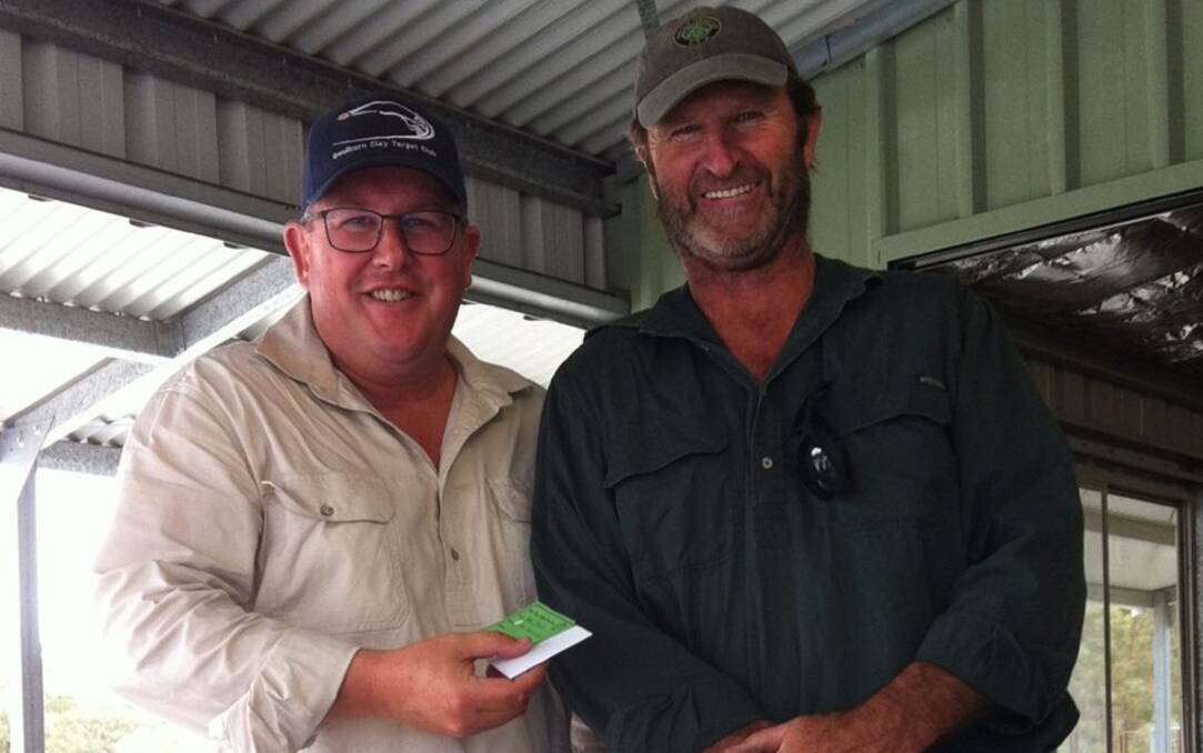 Winner: Mark Taylor (left) took home one of the prizes from the 50 Target Double Barrel Cont Championship on March 17. Photo: Yass Clay Target Club.