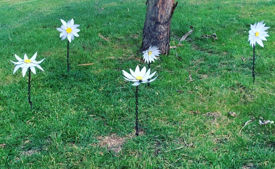 Pretty flowers: 'Daisy Chains' by Melanie Lyons peppered the ground across the paddock, giving it a lovely dappling of white among the green. Photo: Yass Arts. 