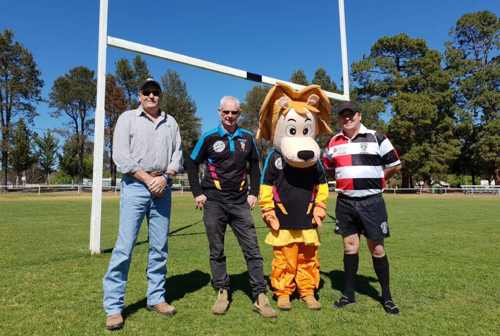 A good cause: (from left) Grant Brewer, Barry O'Mara, Lionel the Lion, and Andy Hewitt at Victoria Park. Hewitt is wearing one of the specially-designed jerseys which will be auctioned after the game. Photo: Zac Lowe.