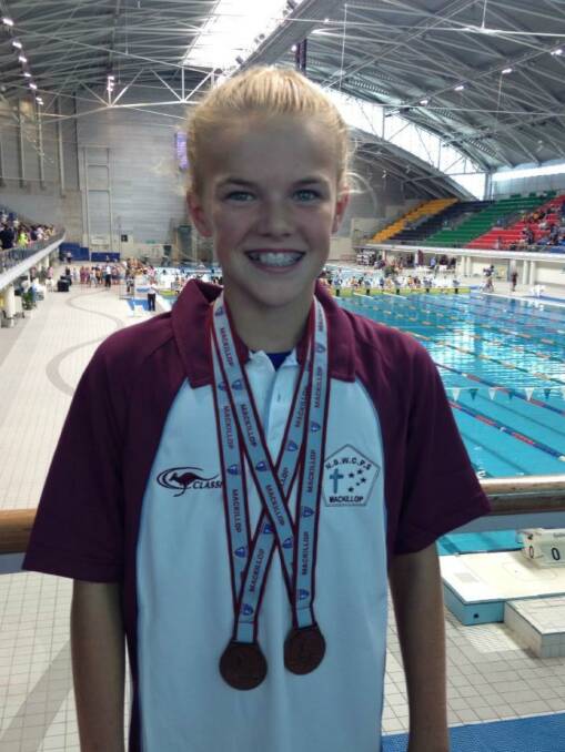Another haul of medals: Youngster Alice Henman is one of the nominees for the 2016 Sporting Awards. Photo: Yass Swim Academy. 