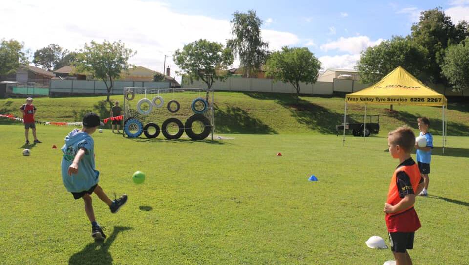 Slot a goal: The tyre challenge has been a big hit for two years running. Photo: Yass Football Club. 