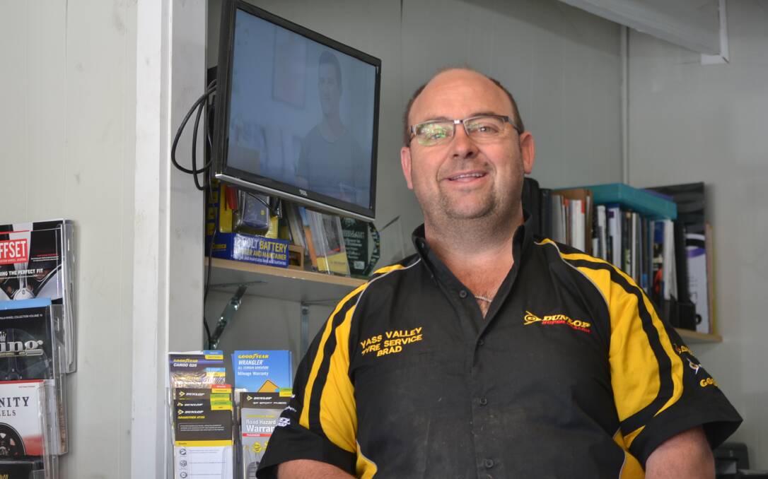 All smiles: Mr Davis in the office of Yass Valley Tyre Service, which is thriving after a few years of hard work establishing itself. Photo: Zac Lowe. 