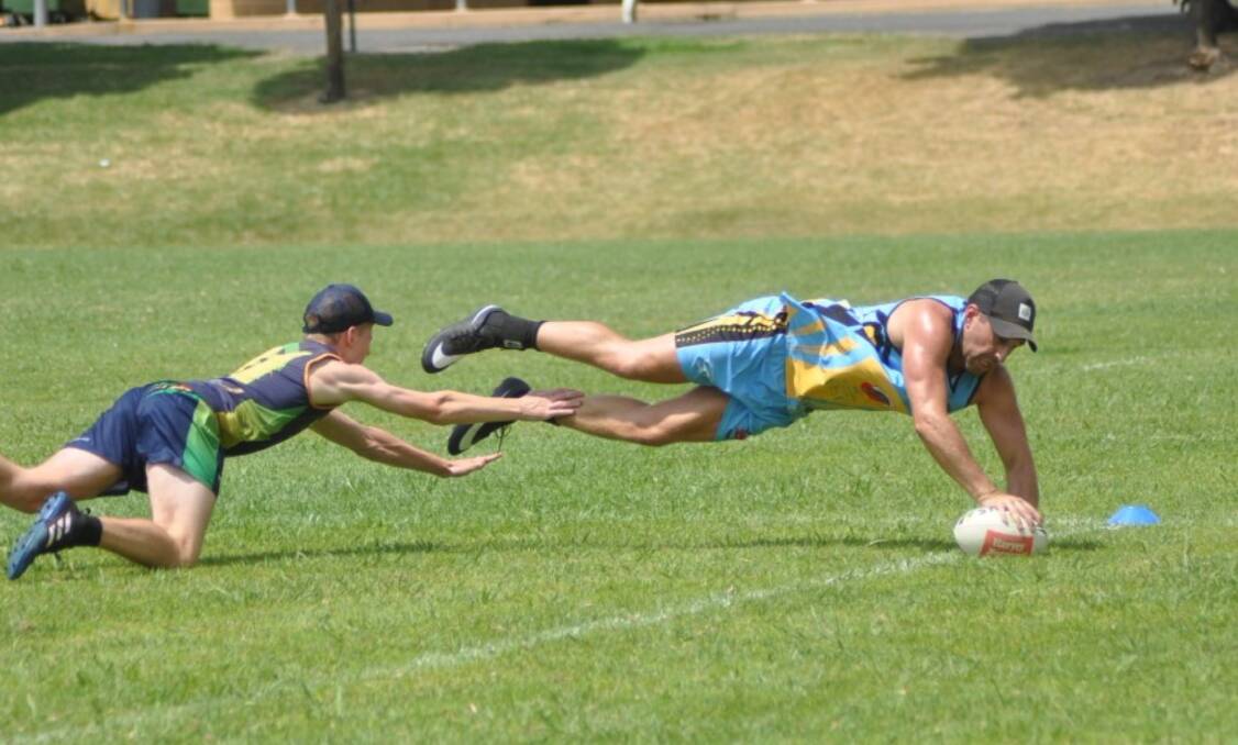 Mid-air: Competitors at the 2018 Touch Knockout put on all sorts of displays of athleticism for spectators to enjoy. Photo: Toby Vue. 