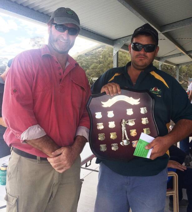 Winner: Glenn Barton (right) with the Ray Smith Memorial Shield following his score of 27/30 on the day. Photo: Yass Clay Target Club.  