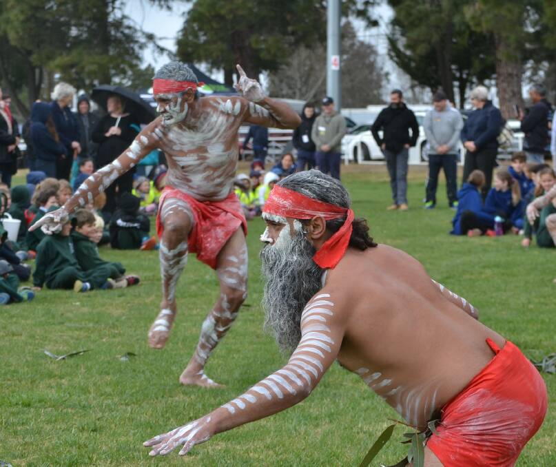 Tradition: David Barnett (front) and Robert Ebsworth performing a traditional Indigenous Australian dance for NAIDOC Week. Photo: Zac Lowe