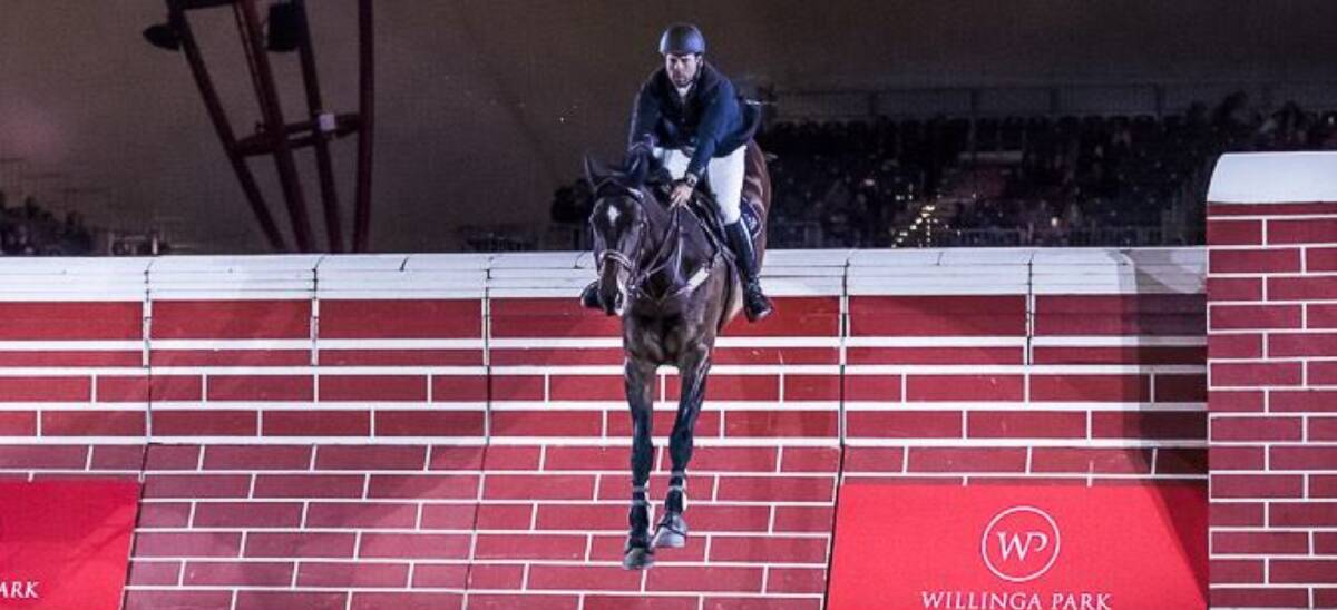 Up and over: Stephen Dingwall clears the Great Wall of Melbourne on Ludicrous recently at Equitana. Photo: Equitana Australia. 
