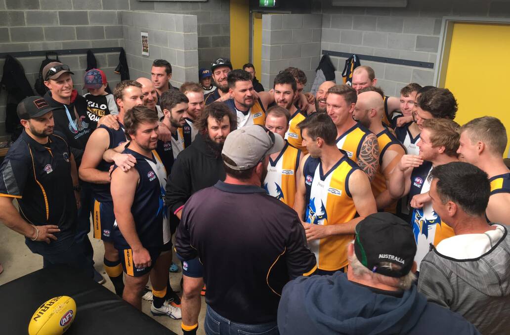 Listen up: Ingold (front, grey hat) addresses the Murrumbateman Eagles during their trial match against the Gungahlin Jets in late March, which held plenty of pleasing signs for the new team. Photo: Murrumbateman Football Club.
