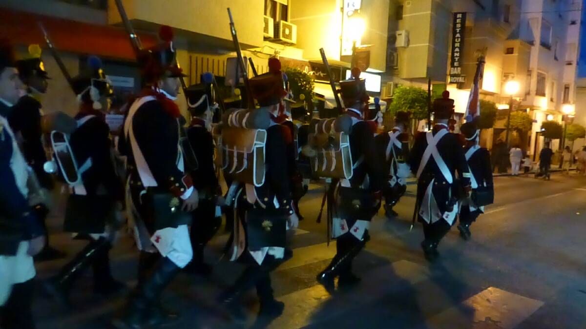 Soldiers march through the streets firing off old muskets. Photo: Nicole Phillips
