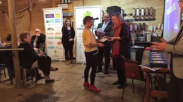 Sophie Peer from Trader & Co accepts the Excellence in Social Enterprise award.