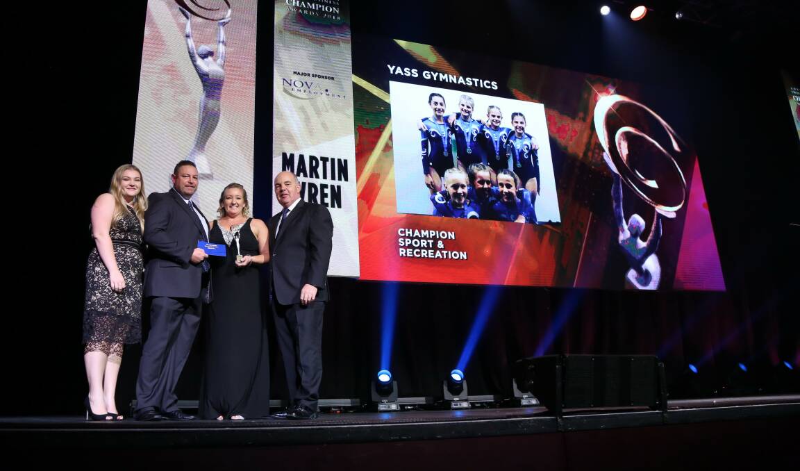Proud winner: Michelle Vitler (second from right) on stage to accept her award for Champion Sport and Recreation Small Business on Saturday night. Photo: Supplied. 