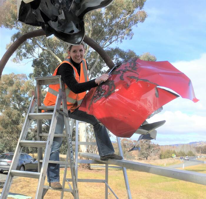 ART FOR VALLEY: Artist Melanie Lyons installing her 'Forgotten' sculpture alongside the Barton Highway, at the Jeir Creek rest area, earlier in 2017. Photo: Supplied