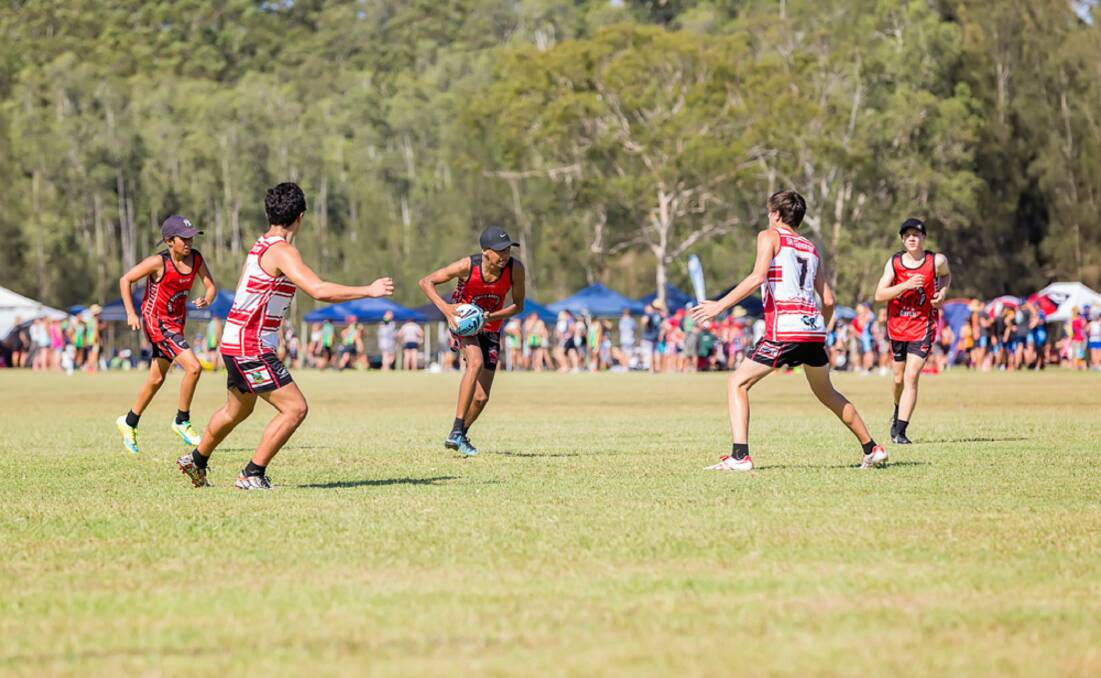 JUNIORS ON THE UP: Two of the players from the Yass Junior Bulls 16 Boys team attacking the opposition at the Junior State Cup in Port Macquarie, hosted by the NSW Touch Football Network. Photo: Sharon Prins Photography.