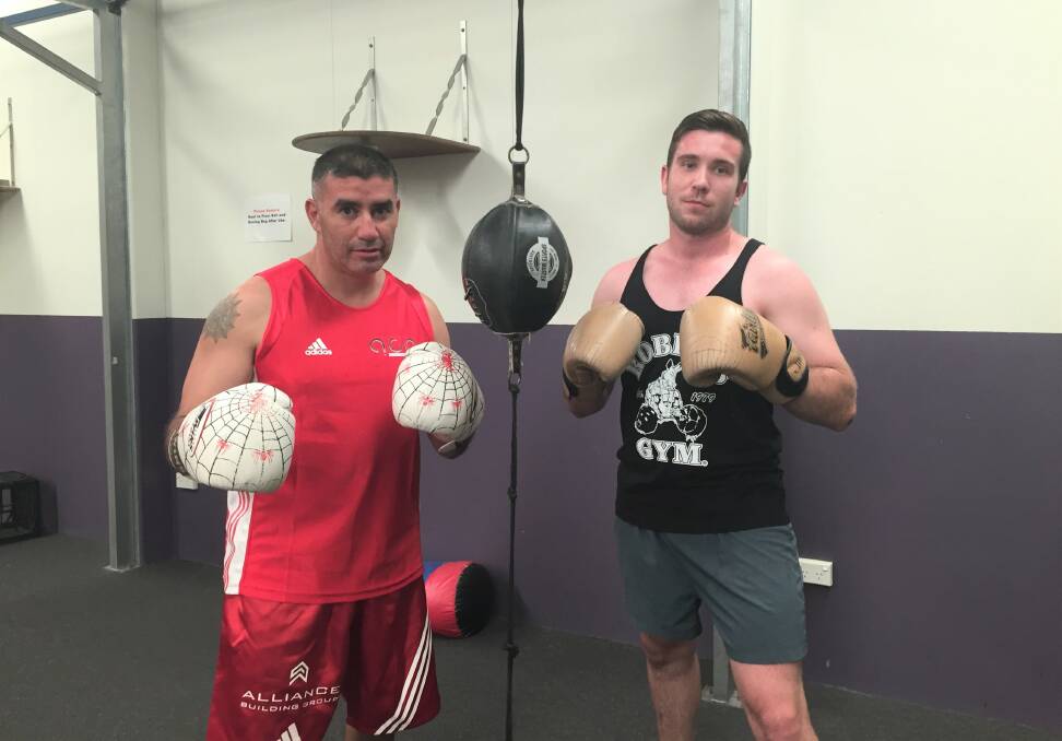 FIGHTING ON: Spider (left) trains for the Masters Boxing Championship earlier in the year. He will carry some injuries into his next fight on April 22. Alongside him is Justin Barton, the state kickboxing champion. Photo: Toby Vue