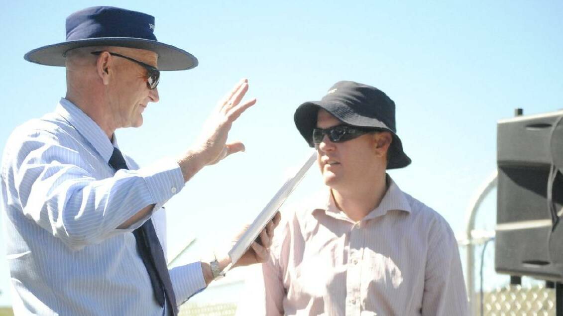 David Rowe speaks with Simon Cassidy, director of operations at the time, during the opening of the upgraded dam in 2013. Photo: Karan Gabriel.
