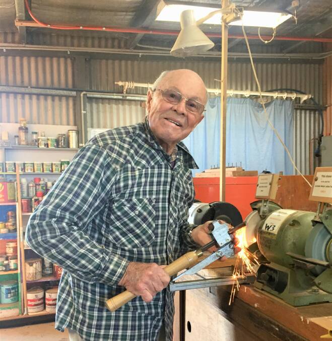 THERAPEUTIC WORK: Ray Armour, a Yass Valley Men's Shed member, works on the grinder for one of his projects. Photo: Toby Vue.