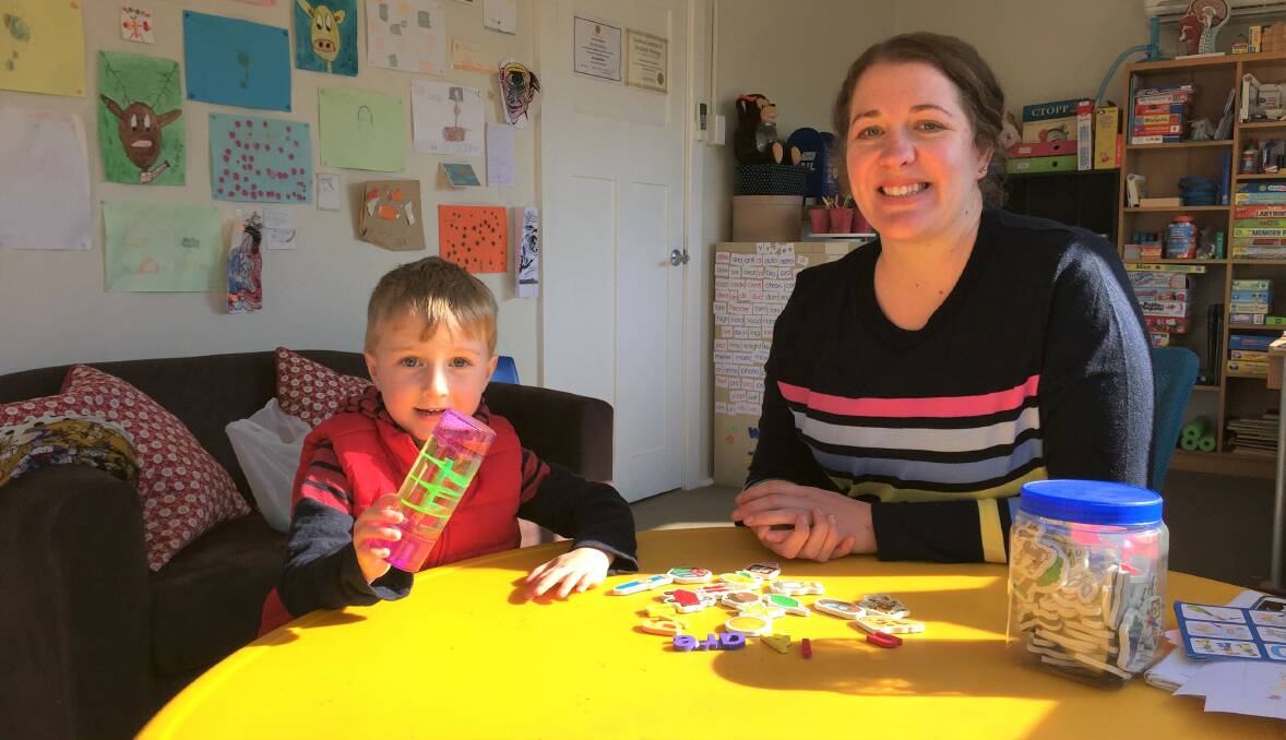 PASSION FOR HELPING: Nicole Lobsey with son Louis at her Yass Valley Speech Pathology office. Photo: Toby Vue.