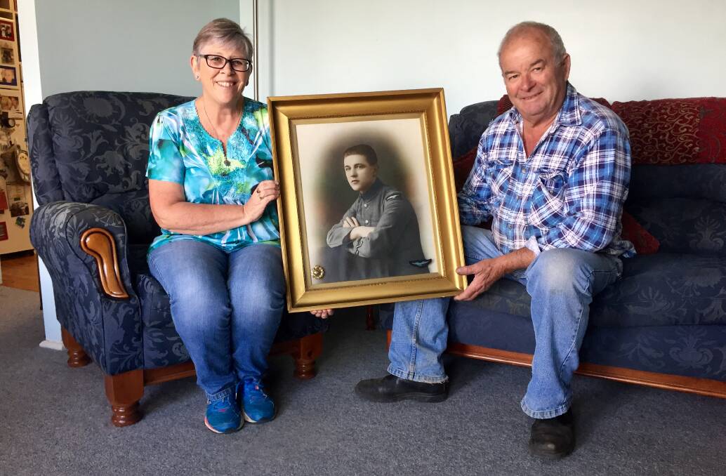 HAPPY ENDING: Jackie and Robert Small were glad to be reunited with the hand-coloured photo of Ms Small's grandfather, Joseph Thomas Alexander Glisson. Photo: Toby Vue.