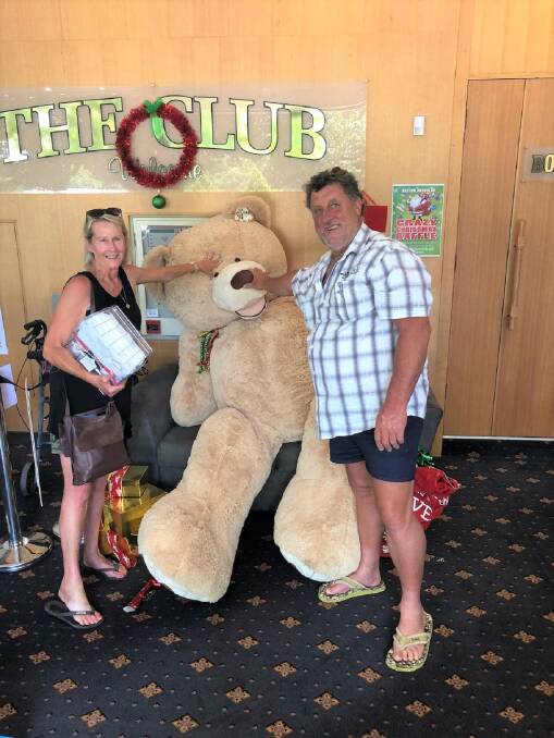Merryn Jones and Frank Wheatley with the teddy bear that will be donated to Canberra Hospital. Photo: Supplied