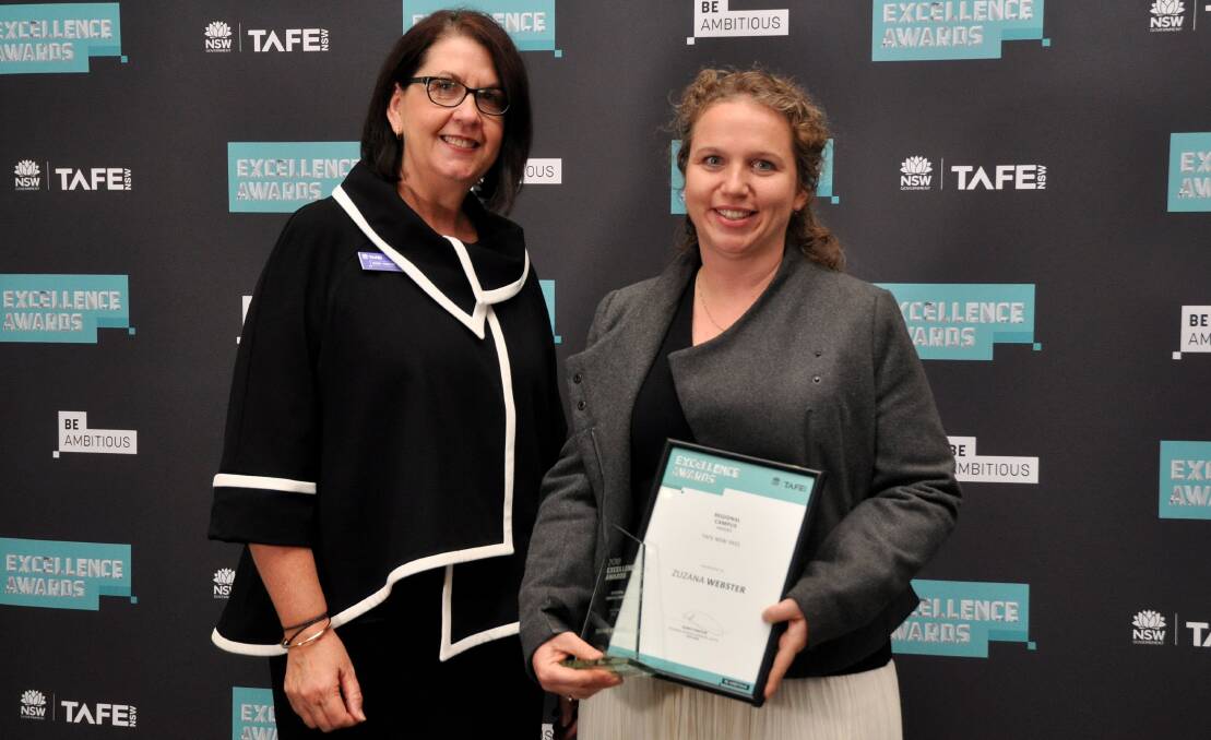 HARD WORK: Zuzana Webster (right) accepts the award for Campus Student of the Year from TAFE NSW regional general manager Kerry Penton in Wollongong on Thursday, May 10. Photo: TAFE NSW.
