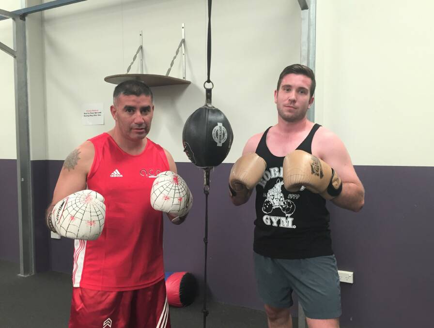 PUMPED: Spider (left) trains for the Masters Boxing Championship. Alongside him is Justin Barton, the state kickboxing champion. Photo: Toby Vue.