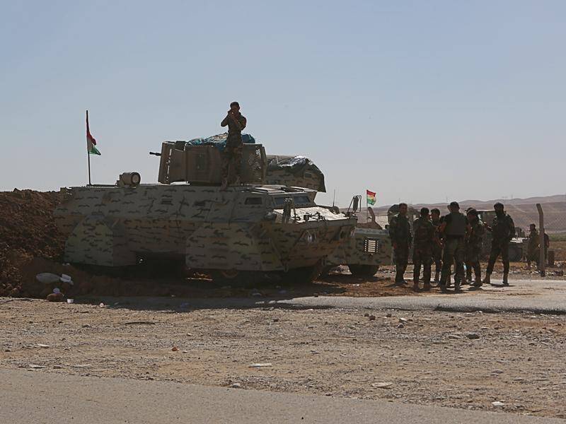 Kurdish security forces stand guard in the Kurdistan region of Iraq.