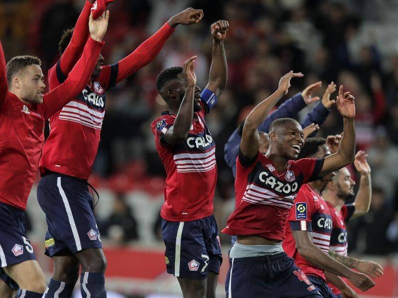 Lille players celebrates after defeating Monaco 4-3. (AP PHOTO)