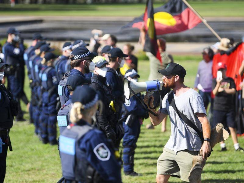 Police and protesters faced off near the Aboriginal Tent Embassy at Old Parliament House on Friday.