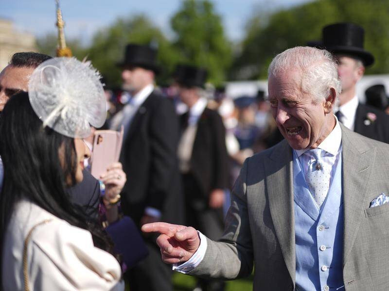 About 8000 people including the King have attended a garden party at Buckingham Palace. (AP PHOTO)