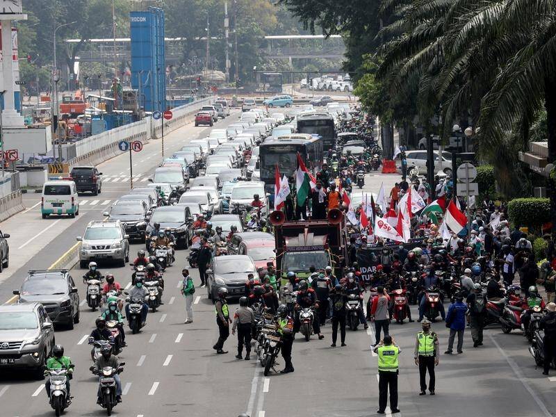 Protesters have marched to the US Embassy in Jakarta to demand an end to Israeli airstrikes on Gaza.