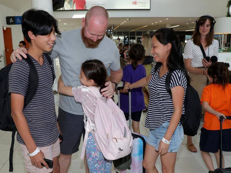 Australian evacuees who were quarantined on Christmas Island arrived back in Sydney and Perth.