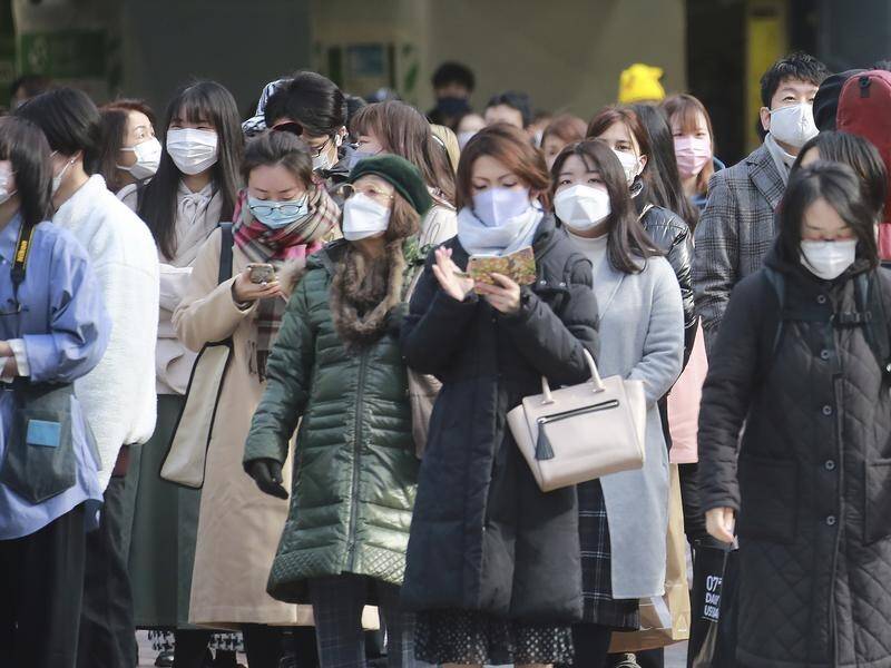 Japan is poised to widen COVID-19 curbs to Tokyo and a dozen regions covering half the population.